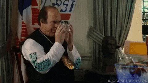 Scene from Idiocracy (2013): An underperforming Oval Office advisor gazes thoughtfully into a glass ball, displaying a rather average level of brightness.